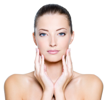 Face of a sexy beautiful young woman with clean skin on a white background