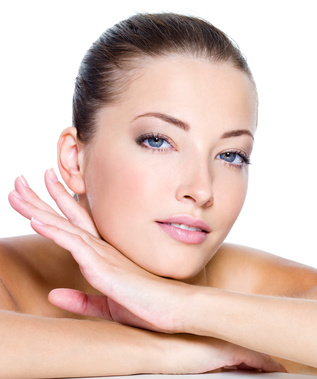 Face of a sexy beautiful young woman with clean skin on a white background